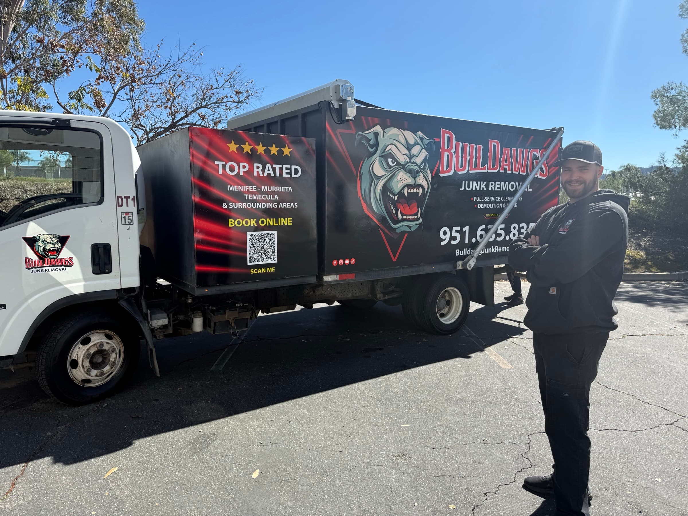 BullDawgs dump truck with TOP RATED Menifee, Murrieta and Temecula wrap, parked and ready for a junk-removal job